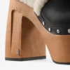 Alida Platform 135 Zwarte glanzende kalfsleren slingbacks met schapenvacht Alida Platform 135 Zwarte glanzende kalfsleren slingbacks met schapenvacht