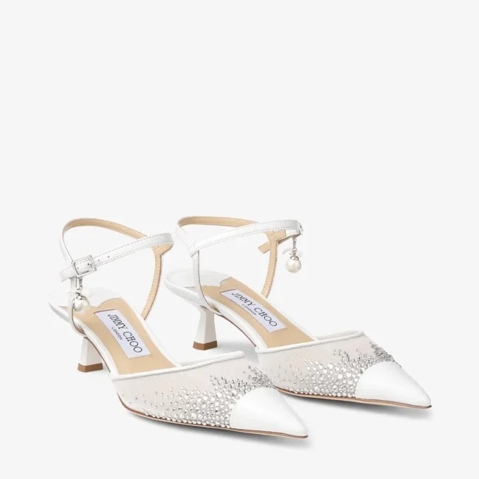 Aren Slingback 45 Witte slingbacks van mesh met kristallen en parelbedeltje Aren Slingback 45 Witte slingbacks van mesh met kristallen en parelbedeltje