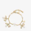 Armband met meerdere bedeltjes en linten  Gouden metalen bedelarmband met linten en parels