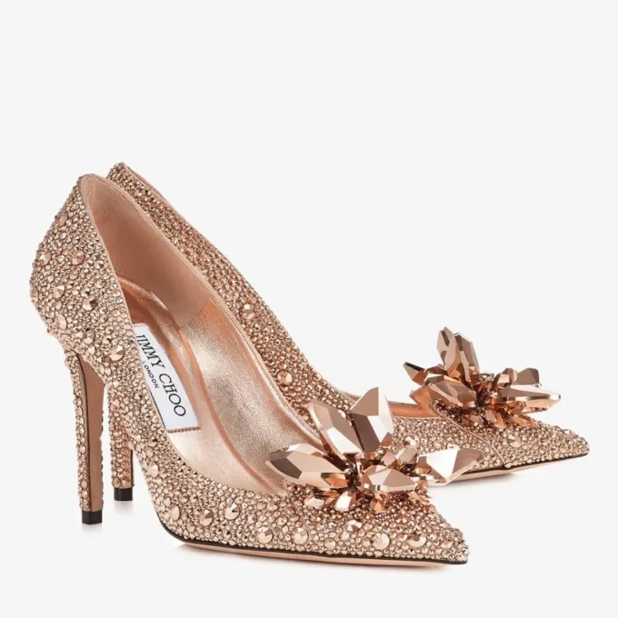 Avril roségouden pumps met puntige neus en kristallen