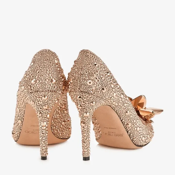 Avril roségouden pumps met puntige neus en kristallen