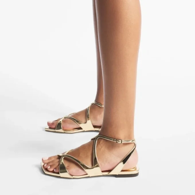 Ayla platte sandalen van goudkleurig metallic leer