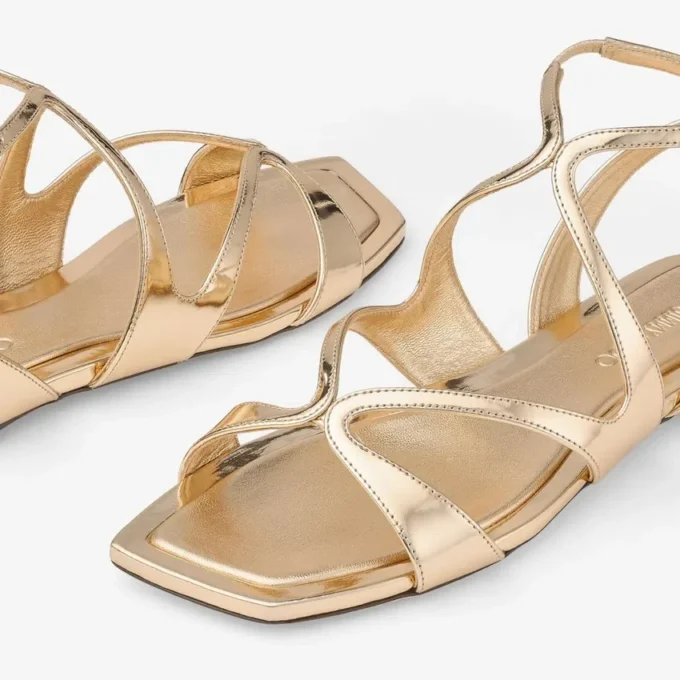 Ayla platte sandalen van goudkleurig metallic leer
