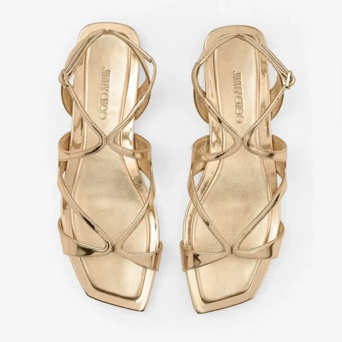 Ayla platte sandalen van goudkleurig metallic leer