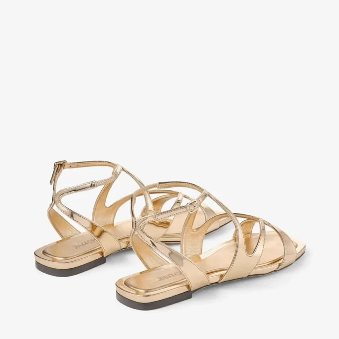 Ayla platte sandalen van goudkleurig metallic leer