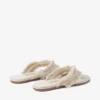 Bay Flat Amandelkleurige platte sandalen van gerafeld canvas met vlekjes Bay Flat Amandelkleurige platte sandalen van gerafeld canvas met vlekjes