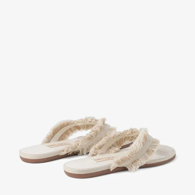 Bay Flat Amandelkleurige platte sandalen van gerafeld canvas met vlekjes Bay Flat Amandelkleurige platte sandalen van gerafeld canvas met vlekjes