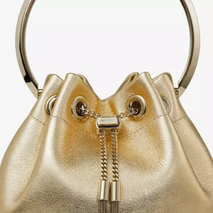 Bon Bon goudkleurige metallic nappa tas met metalen handvat Bon Bon goudkleurige metallic nappa tas met metalen handvat