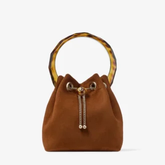 Bon Bon Tan suède bucket bag met kralensluiting en schildpadkleurig handvat