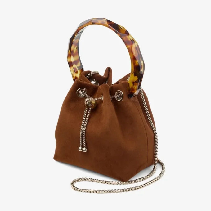 Bon Bon Tan suède bucket bag met kralensluiting en schildpadkleurig handvat Bon Bon Tan suède bucket bag met kralensluiting en schildpadkleurig handvat