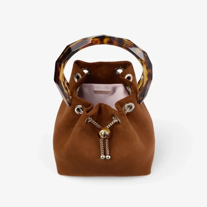 Bon Bon Tan suède bucket bag met kralensluiting en schildpadkleurig handvat Bon Bon Tan suède bucket bag met kralensluiting en schildpadkleurig handvat