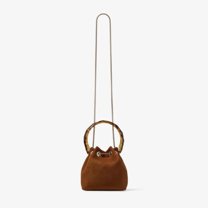 Bon Bon Tan suède bucket bag met kralensluiting en schildpadkleurig handvat Bon Bon Tan suède bucket bag met kralensluiting en schildpadkleurig handvat