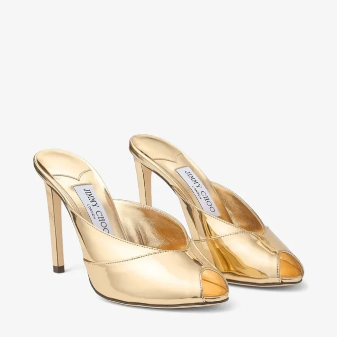 Brigitte Mule 100 Mules van goudkleurig vloeibaar metaal Brigitte Mule 100 Mules van goudkleurig vloeibaar metaal