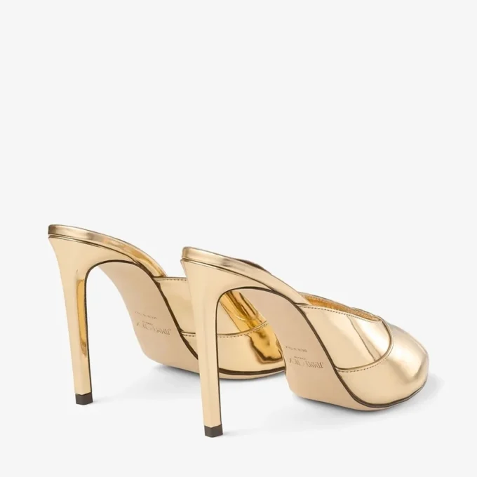 Brigitte Mule 100 Mules van goudkleurig vloeibaar metaal Brigitte Mule 100 Mules van goudkleurig vloeibaar metaal