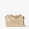Callie schoudertas met klep van goudkleurig metallic leer