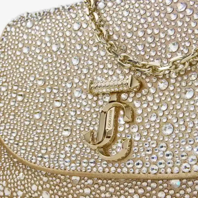 Curve Clutch Goudglanzende suède clutch met hotfix-kristallen