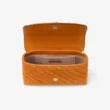 Curve Crossbody Small Sunset Orange gewatteerde suède crossbodytas