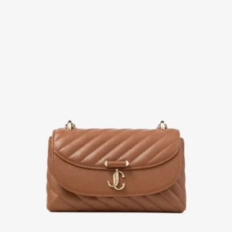 Curve Crossbody Small Tan gewatteerde crossbodytas van bikerleer