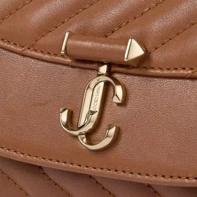 Curve Crossbody Small Tan gewatteerde crossbodytas van bikerleer Curve Crossbody Small Tan gewatteerde crossbodytas van bikerleer
