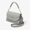 Curve Top Handle Dove gewatteerde Biker-leren tas met handvat en parelversiering