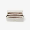 Curve Top Handle Latte gewatteerde nappalederen tas met handvat en parelversiering