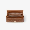 Curve Top Handle Tan gewatteerde Biker-leren tas met handvat en parelversiering