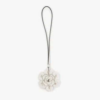 Gebreide bloemenbedel Latte Gebreide wollen bloemenbedel met leren afwerking