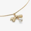 Hanger met lint Gouden metalen hanger met lint en parel