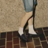 Ivy Loafer Zwarte loafers van leer met krokodillenreliëf