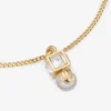 Jc Pearl Cube-armband Gouden metalen armband met parel en kristallen kubus Jc Pearl Cube-armband Gouden metalen armband met parel en kristallen kubus