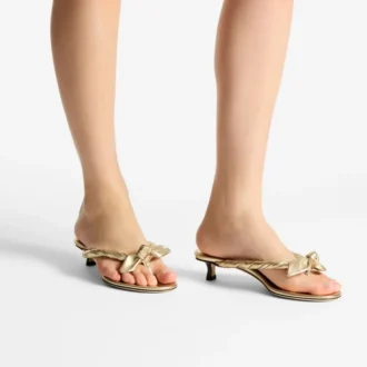Liss 35 goudkleurige metallic nappaleren muilsandalen met strik