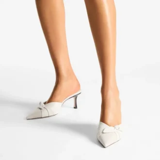 Livi 65 Mules van gemêleerd canvas in amandel- en latte-tinten en zacht handschoenleer met strik van nappaleer