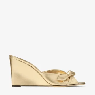Livi Wedge 85 Goudkleurig metallic nappaleer muiltjes met sleehak en strik