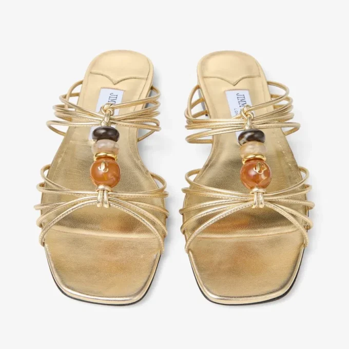Lova Mule Flat Goudkleurige metallic nappaleren muiltjes met kralen Lova Mule Flat Goudkleurige metallic nappaleren muiltjes met kralen