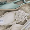 Mimmi Slingback 50 Latte Glanzende nappalederen slingbacks met kanten corsage Mimmi Slingback 50 Latte Glanzende nappalederen slingbacks met kanten corsage