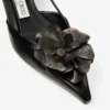 Mimmi Slingback 50 Zwarte slingbacks van glanzend nappaleer met corsage van nappakant Mimmi Slingback 50 Zwarte slingbacks van glanzend nappaleer met corsage van nappakant