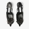 Mimmi Slingback 50 Zwarte slingbacks van glanzend nappaleer met corsage van nappakant Mimmi Slingback 50 Zwarte slingbacks van glanzend nappaleer met corsage van nappakant