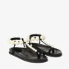 Miro platte zwarte suède sandalen met parelmoeren bolletjes
