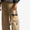Zakje met trekkoord en handvat Natuurlijk en zwart zacht raffia zakje met trekkoord en leren afwerking Zakje met trekkoord en handvat Natuurlijk en zwart zacht raffia zakje met trekkoord en leren afwerking