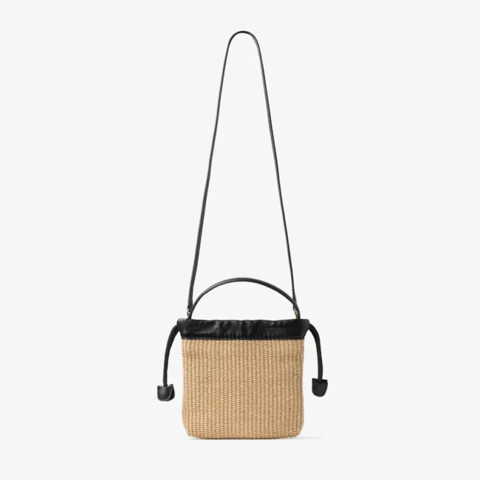Zakje met trekkoord en handvat Natuurlijk en zwart zacht raffia zakje met trekkoord en leren afwerking Zakje met trekkoord en handvat Natuurlijk en zwart zacht raffia zakje met trekkoord en leren afwerking