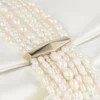 Zandra ivoorkleurige satijnen clutch